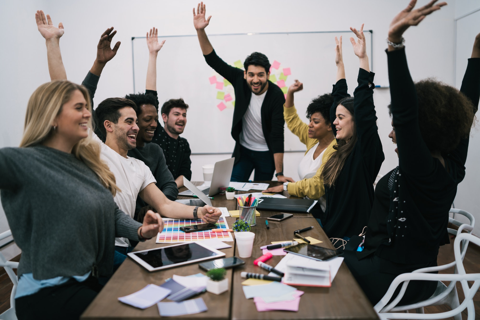 dentista business team celebrating with raised up hands