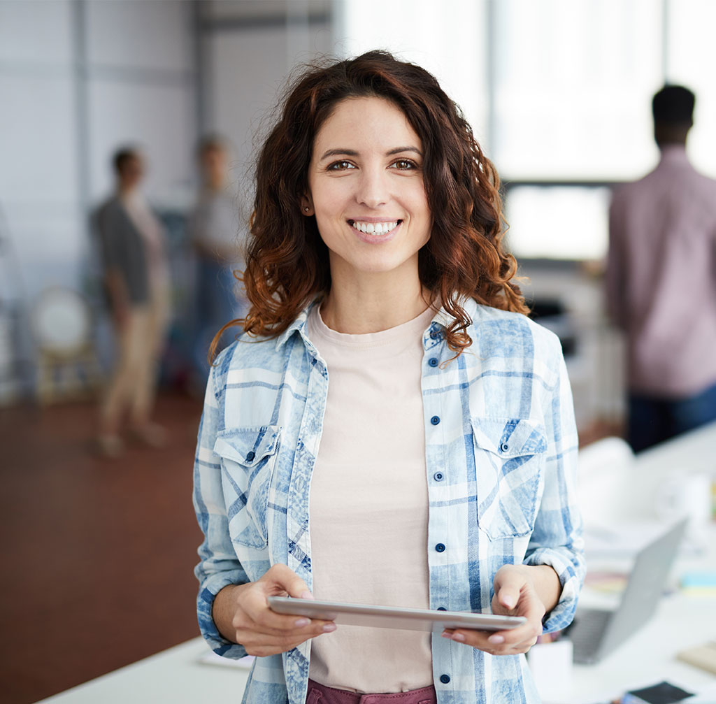 dentista cheerful young woman posing in creative agency P8NMKLX