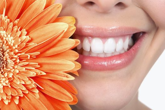 Beautiful young woman smile and teeth.  Close up