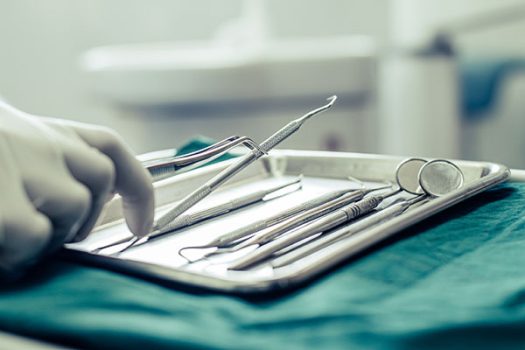 Dentists choose equipment on the table.